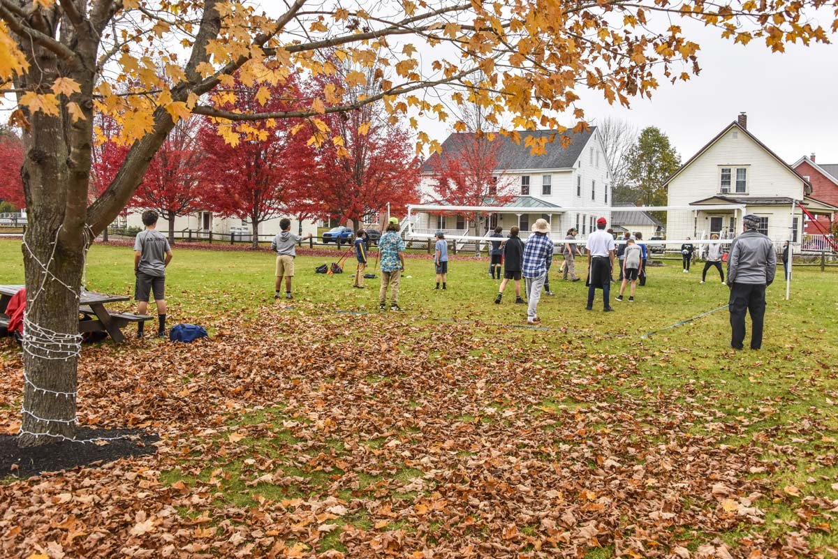 Students playing volleyball in the fall